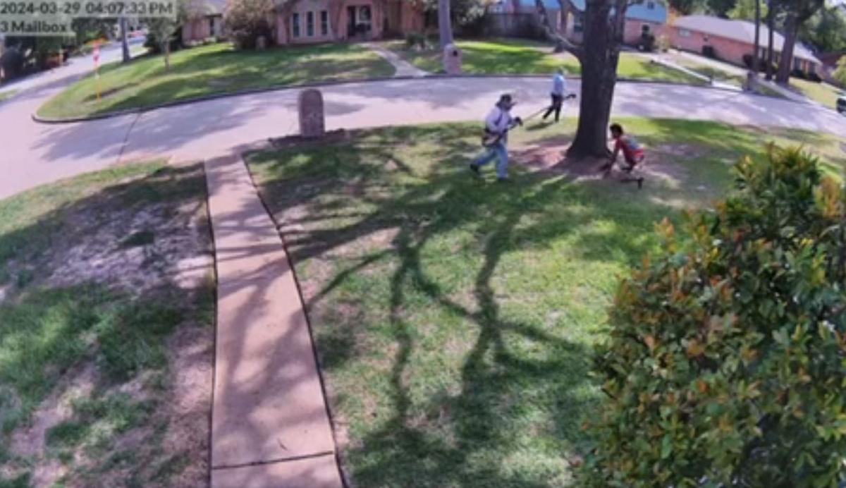 The worker, wielding a weed eater, confronts a suspect. (Courtesy of Harris County Precinct 4 Constable’s Office)