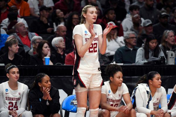 Cameron Brink cheers from the Stanford bench after fouling out during an NCAA Tournament game against North Carolina State in Portland, Ore., on March 29, 2024. (Steve Dykes/AP Photo)