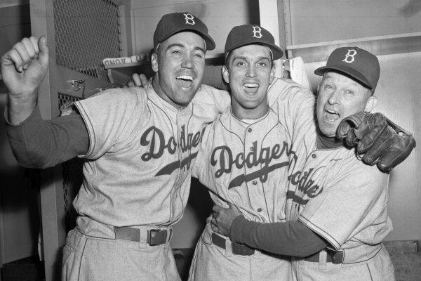 Carl Erskine (C) celebrates with Brooklyn Dodgers teammate Duke Snider (L) and Manager Charley Dressen after beating the Yankees in Game 5 of the World Series in New York on Oct. 5, 1952. (AP Photo)