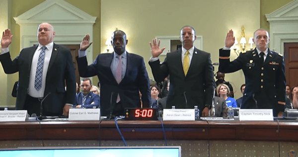 From left to right, Command Sgt. Maj. Michael Brooks, Col. Earl Matthews, Brig. Gen. Aaron Dean, and Capt. Timothy Nick, all of the District of Columbia National Guard, are sworn in during a hearing in Washington on April 17, 2024. (House Administration Committee via The Epoch Times)
