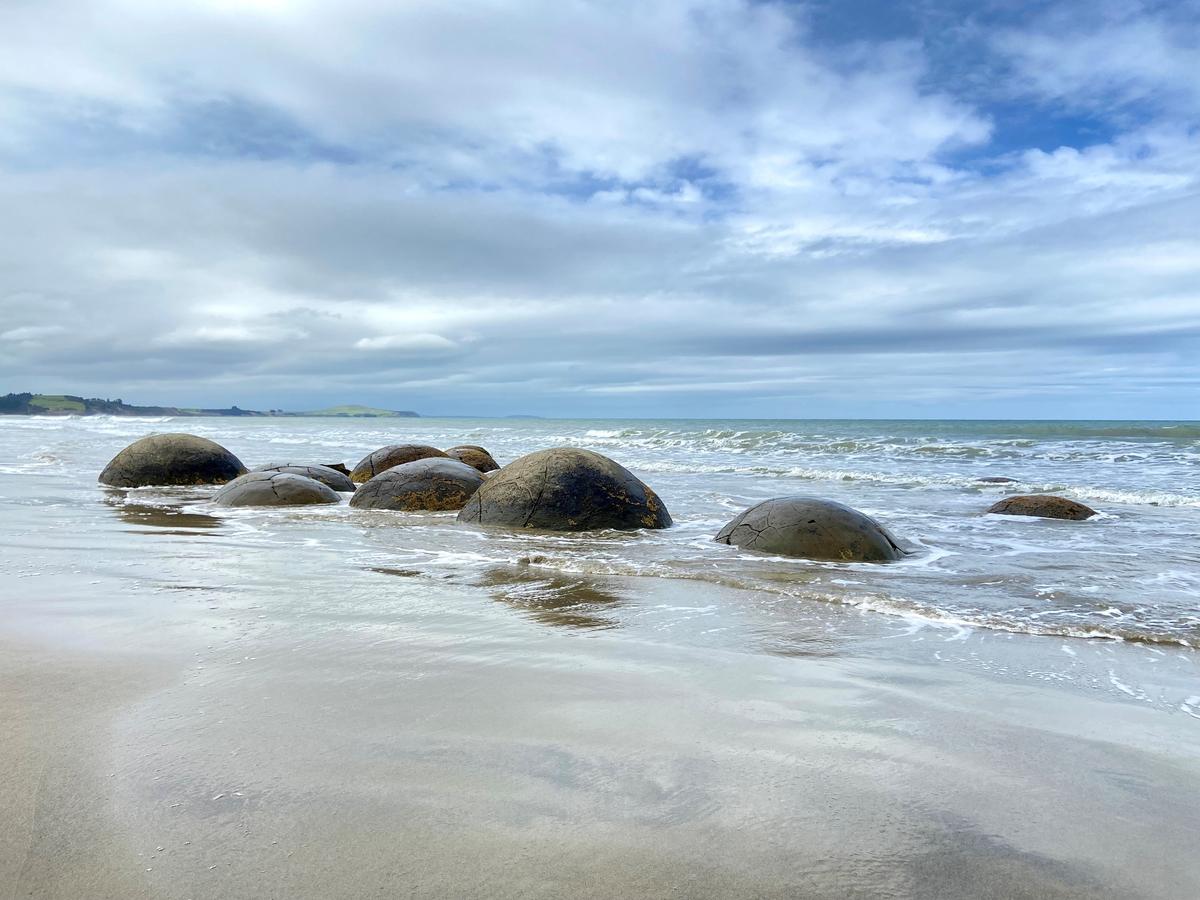The Moeraki Boulders, unusually large spherical boulders spread out along a section of the Otago coast, in New Zealand on Dec. 6, 2022. (Daniel Teng/The Epoch Times)