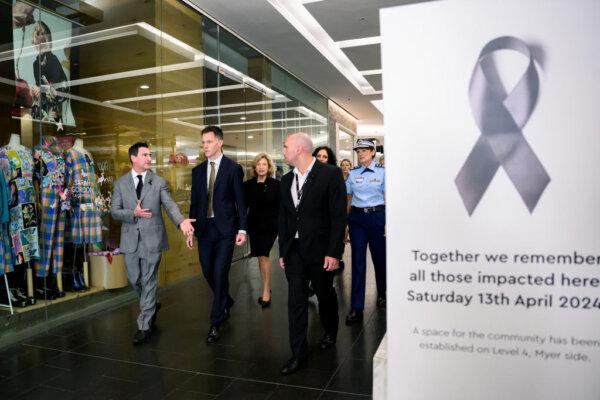 Scentre Group Chief Executive Elliott Rusanow (L), and NSW Premier Chris Minns (C) walk through Westfield Bondi Junction shopping centre prior to its reopening following Saturday's knife attack at Westfield Bondi Junction on April 18, 2024 in Bondi Junction, Australia. (Photo by Bianca di Marchi - Pool/Getty Images)