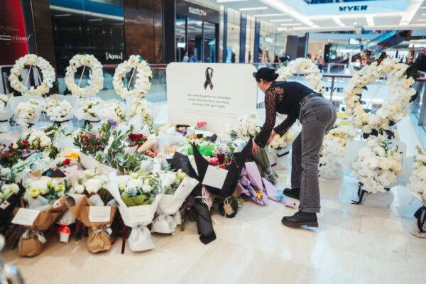 Members of the public pay their respects at the Westfield Bondi Junction shopping centre during a day of reflection on April 18, 2024 in Sydney, Australia. (Photo by Dion Georgopoulos - Pool/Getty Images)