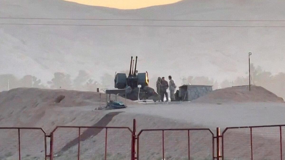Military personnel stand guard at a nuclear facility in the Zardanjan area of Isfahan, Iran, on April 19, 2024, in this screengrab taken from video. (West Asia News Agency via Reuters)
