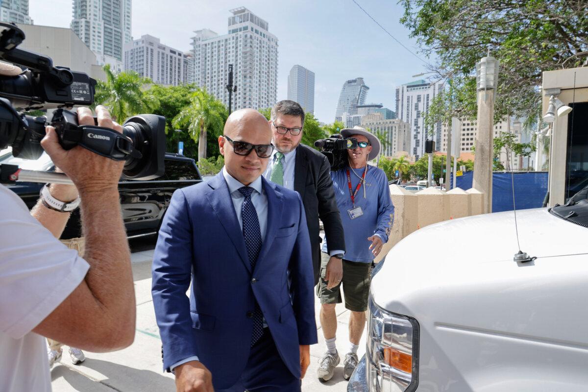 Walt Nauta, valet to former President Donald Trump and a co-defendant in federal charges filed against Mr. Trump, arrives with lawyer Stanley Woodward at the James Lawrence King Federal Justice Building in Miami on July 6, 2023. (Alon Skuy/Getty Images)