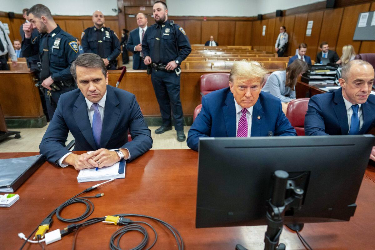 Former President Donald Trump (C) sits with his attorneys Todd Blanche (L) Emil Bove (R) and during his criminal trial as jury selection continues at Manhattan Criminal Court in New York City on April 19, 2024. (Mark Peterson - Pool/Getty Images)