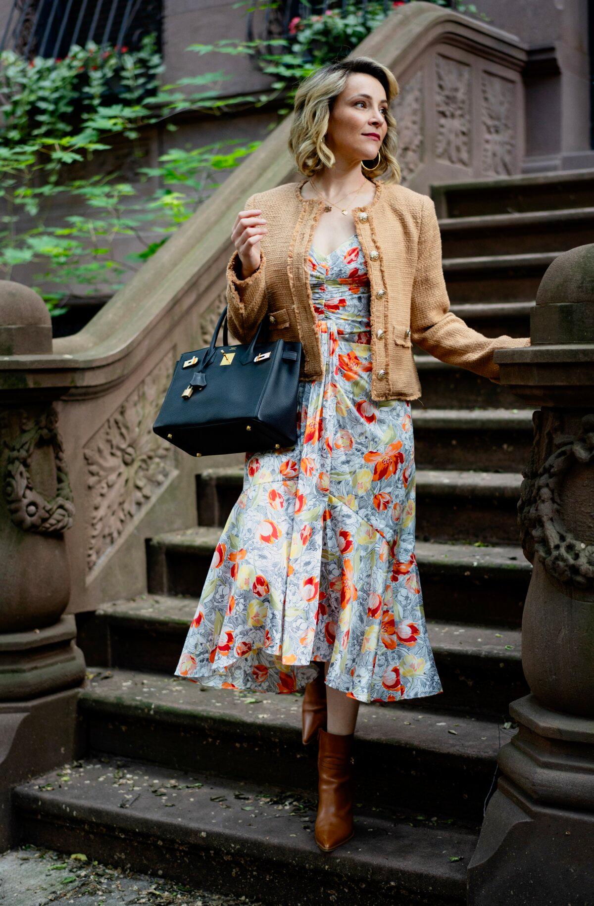 Ms. Bernay pairs her floral dress with a tan-colored tweed jacket and a black designer bag. (Samira Bouaou for American Essence)