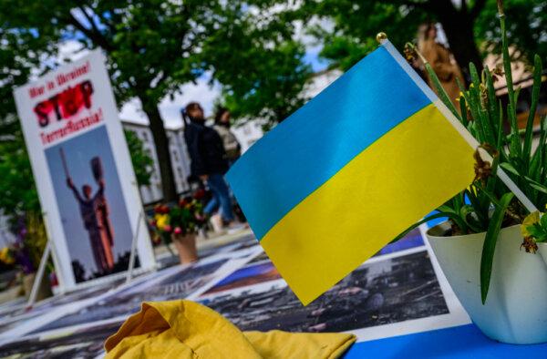 A Ukrainian flag flies at a makeshift memorial in front of the Russian embassy in Berlin dedicated to Ukrainian victims of the Russia-Ukraine conflict, on April 21, 2024. (John MacDougall/AFP via Getty Images)