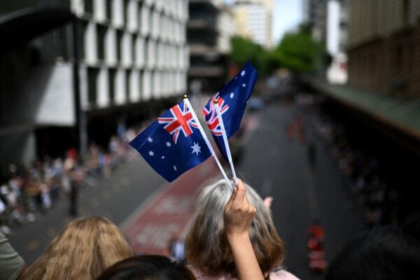 Crowds watch as veterans and serving members of the Australian and New Zealand armed forces march during an Anzac Day parade in Brisbane, Australia, on April 25, 2023. (Dan Peled/Getty Images)
