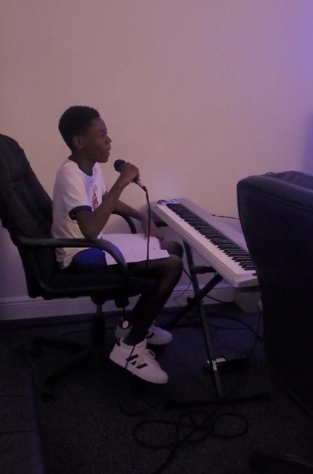 Aiden's love for music inspired him to compose his first song. (Courtesy of Kemorene Mills-Armstrong)