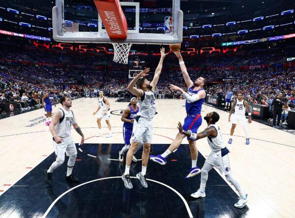 Ivica Zubac (40) of the LA Clippers takes a shot against Maxi Kleber (42) of the Dallas Mavericks in the second half during game one of the Western Conference First Round Playoffs in Los Angeles on April 21, 2024. (Ronald Martinez/Getty Images)