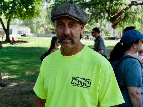 Tim Clement, outreach director for the Christian-based Survivors of the Abortion Holocaust, joins the California March for Life in Sacramento on April 22, 2024. (Travis Gillmore/The Epoch Times)