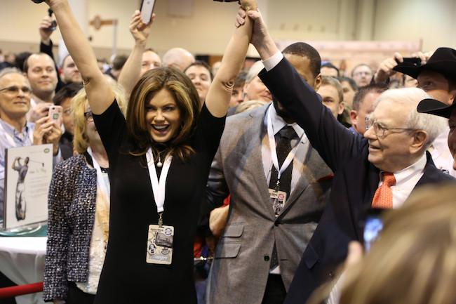 Ms. Ireland and businessman Warren Buffett at the annual newspaper-throwing contest at a Berkshire Hathaway shareholders meeting. “He’s got a few years on me, but he’s really good,” Ms. Ireland said. Both had newspaper delivery jobs when they were young. (Courtesy of Jon Carrasco)