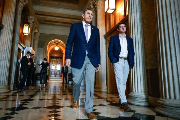Sen. Joe Manchin (D-W.Va.) walks out of the Senate Chamber at the U.S. Capitol in Washington on March 22, 2024. (Chip Somodevilla/Getty Images)