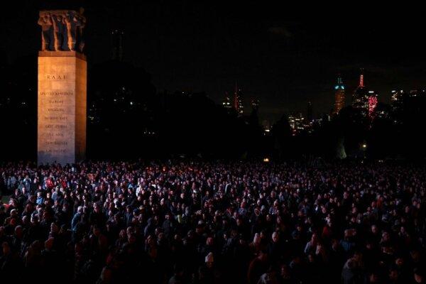 People gather to pay their respects during the ANZAC (Australian and New Zealand Army Corps) Day dawn service at the Shrine of Remembrance, to remember soldiers who have died in war, in Melbourne, Australia, on April 25, 2024. (Martin Keep/AFP via Getty Images)