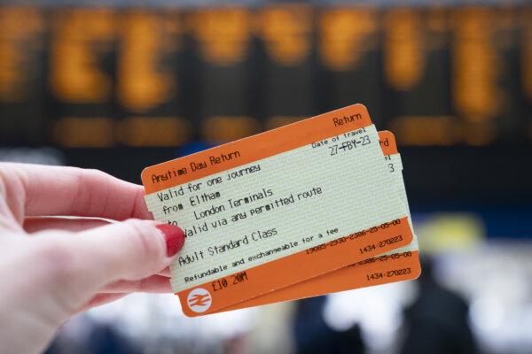 A woman holds train tickets at Waterloo train station in London on March 3, 2023. (Kirsty O'Connor/PA Wire)