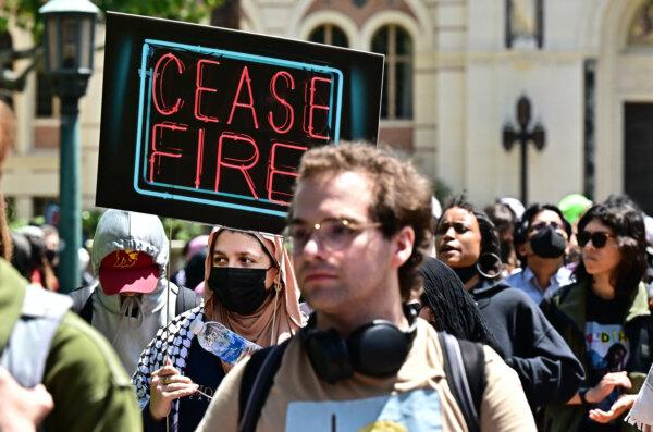 Pro-Palestinian students march and hold signs as they protest the Israel-Hamas war on the campus of the University of Southern California in Los Angeles on April 24, 2024. (Frederic J. Brown/AFP via Getty Images)
