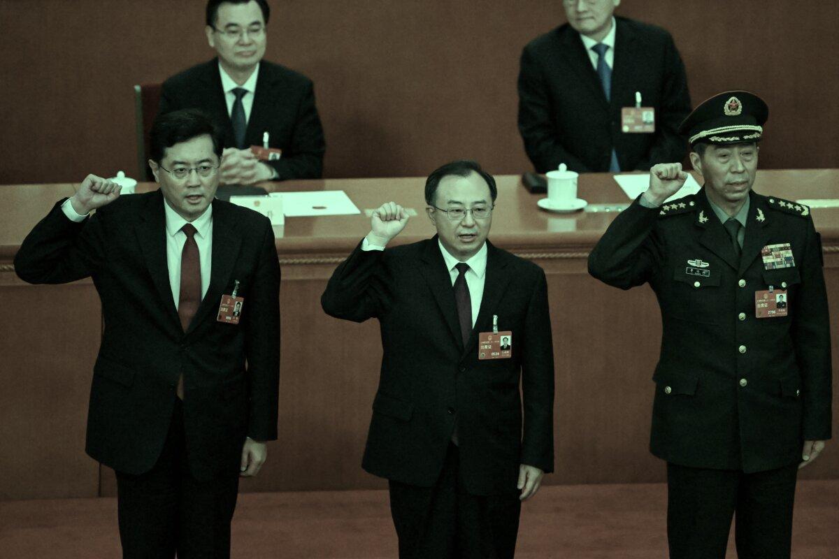 (L-R) Newly-elected Chinese state councilor Qin Gang, state councilor and secretary-general of the State Council Wu Zhenglong, state councilor Li Shangfu swear an oath during the fifth plenary session of the National People's Congress (NPC) at the Great Hall of the People in Beijing on March 12, 2023. (Noel Celis/AFP via Getty Images)