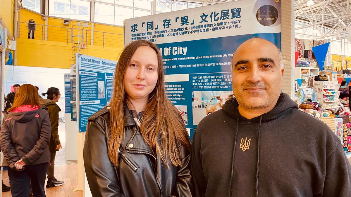 Ben (R), a native Brummy, and his wife told us that he was happy to be able to continue to be in touch with Hong Kong culture, even in Birmingham. (Tetra Li/The Epoch Times)