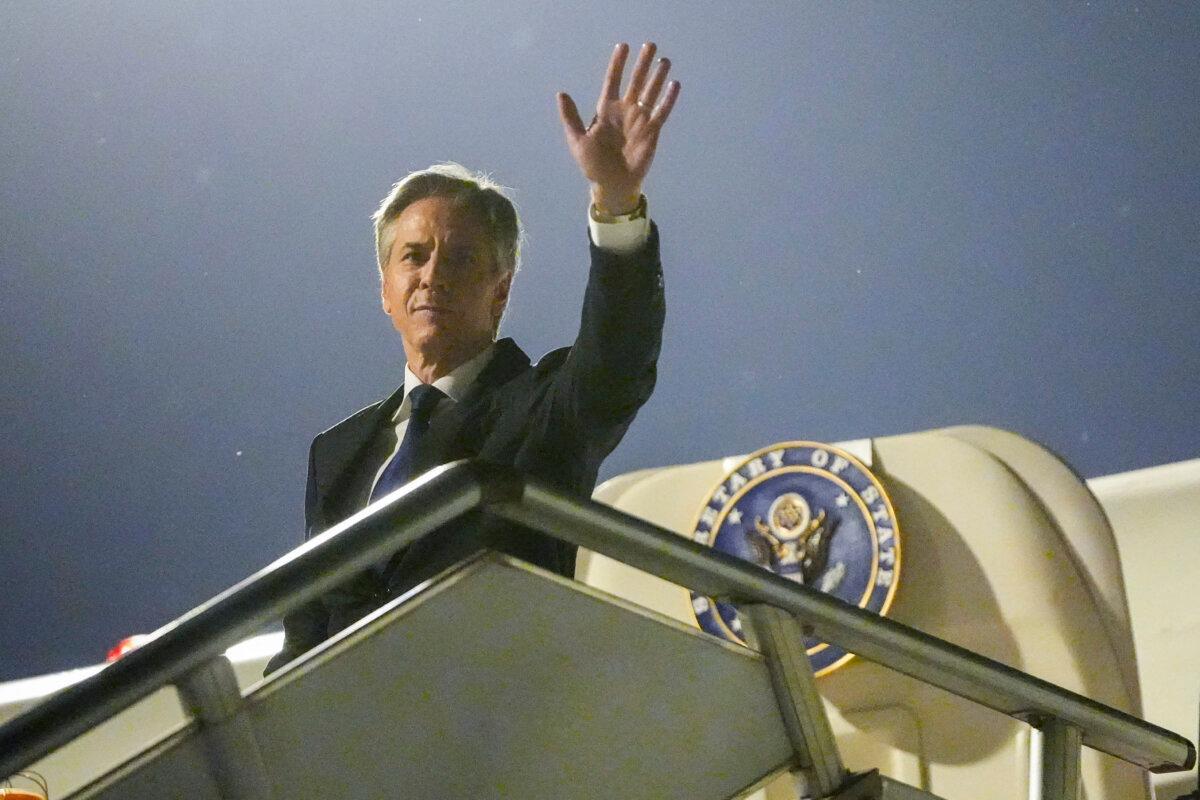 U.S. Secretary of State Antony Blinken waves as he prepares to return to US following a visit to China, at the Beijing Capital International Airport in Beijing on April 26, 2024. (Mark Schiefelbein/POOL/ AFP via Getty Images)