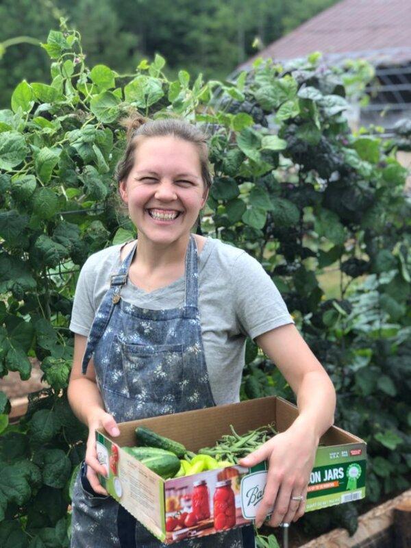 Meg Hollar harvests home-grown produce on her family's homestead. (Courtesy of Meg and Ben Hollar)