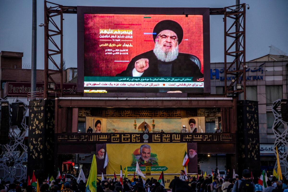 People gather to watch Hezbollah Secretary General Hassan Nasrallah's speech regarding the Israel-Hamas conflict in Tehran, Iran, on Nov. 3, 2023. (HOSSEIN BERIS/Middle East Images/AFP via Getty Images)