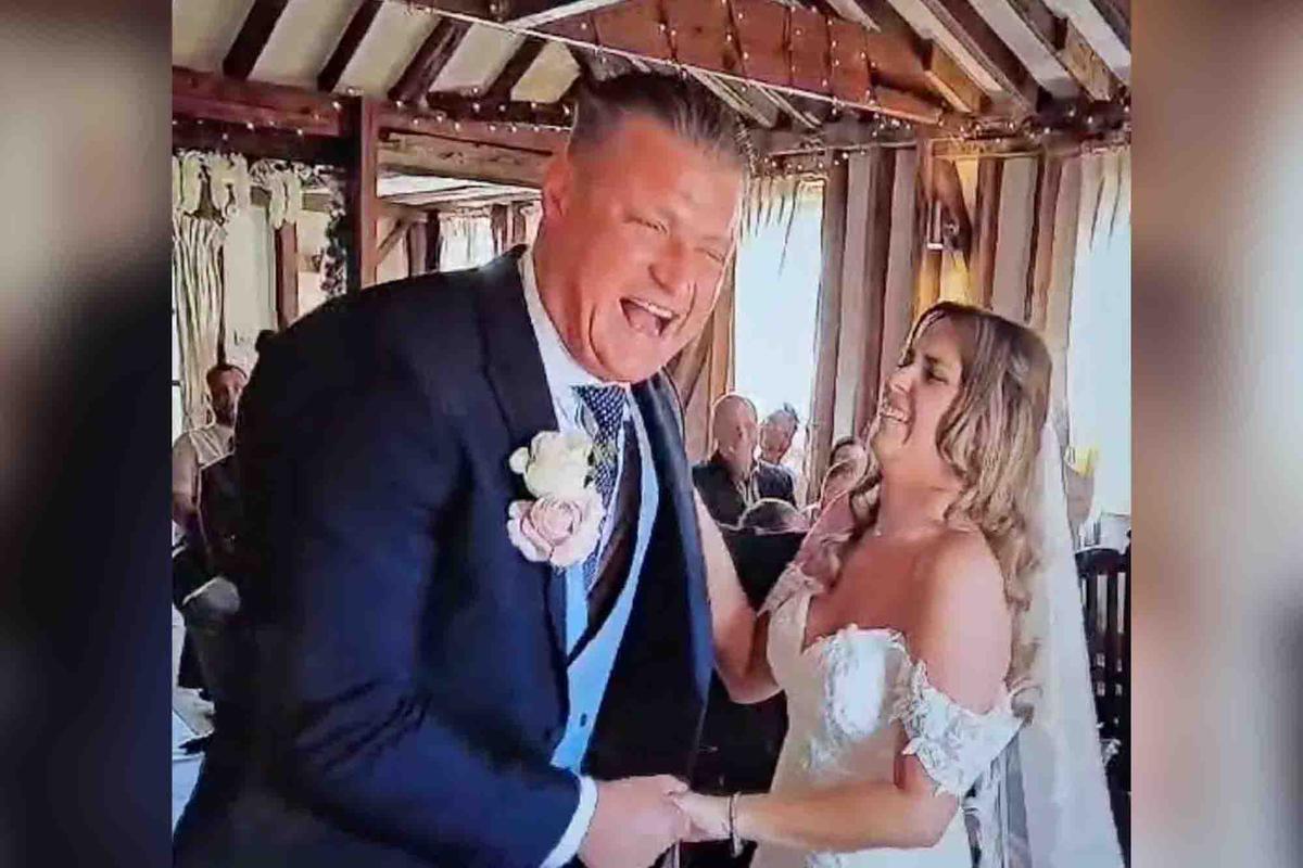 A couple taking their wedding vows crack up as the groom goofs his lines. (Screenshot/Newsflare)
