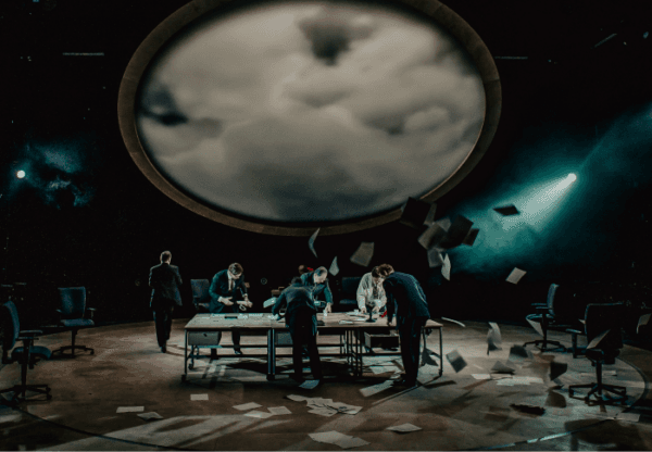 The set of "The Agreement," with papers flying around, seem to reflect the political tumult it seeks to resolve. (Carrie Davenport)