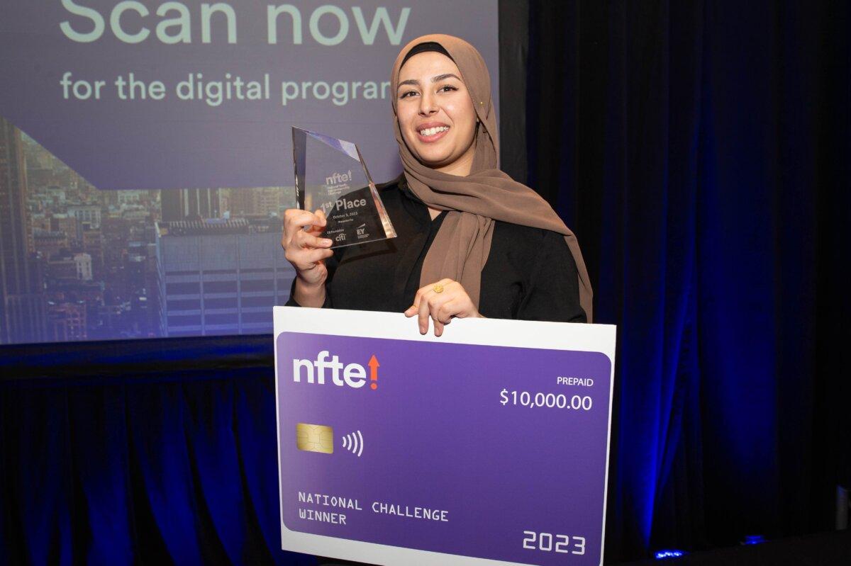 Ms. Al Suwaidani poses with her prize for winning NFTE's national entrepreneurship challenge. (Kristy Leibowitz for NFTE.com)