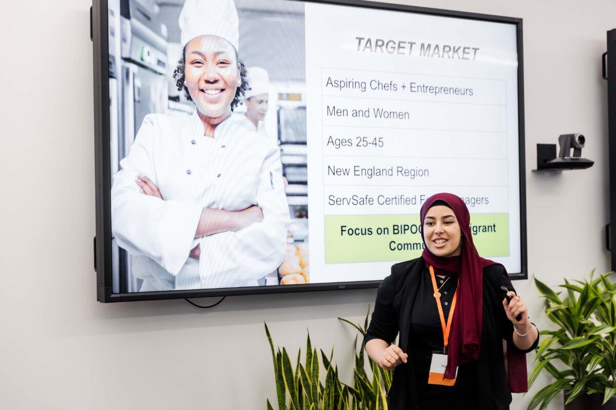 Raneem Al Suwaidani pitches her food truck rental idea during the national NFTE pitch competition. (Joe Curry Photography for NFTE.com)