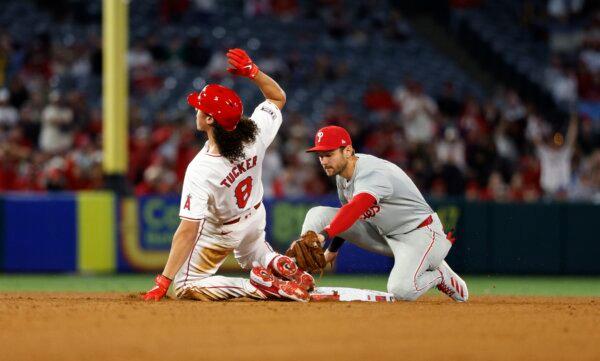 Cole Tucker (8) of the Los Angeles Angels slides in to second base after hitting a double with Trea Turner (7) of the Philadelphia Phillies applying the tag during the sixth inning in Anaheim, Calif., on April 30, 2024. (Kevork Djansezian/Getty Images)