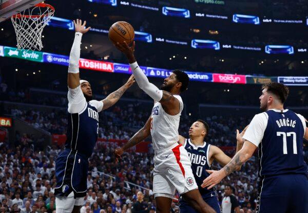Paul George (13) of the LA Clippers takes a shot against Dereck Lively II (2) of the Dallas Mavericks in the first half during game five of the Western Conference First Round Playoffs in Los Angeles on May 1, 2024. (Ronald Martinez/Getty Images)