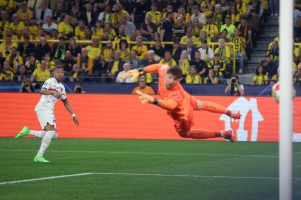Kylian Mbappe of Paris Saint-Germain hits the goal post with a shot against Gregor Kobel of Borussia Dortmund during the UEFA Champions League semi-final first leg match between Borussia Dortmund and Paris Saint-Germain in Dortmund, Germany, on May 1, 2024 . (Alex Grimm/Getty Images)