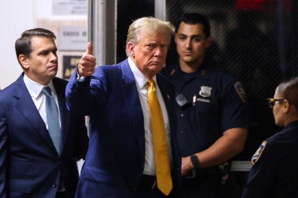 Former President Donald Trump gives a thumbs up as he returns to the courtroom after a break in his trial for allegedly covering up hush money payments at Manhattan Criminal Court on May 2, 2024. (Charly Triballeau/Getty Images)