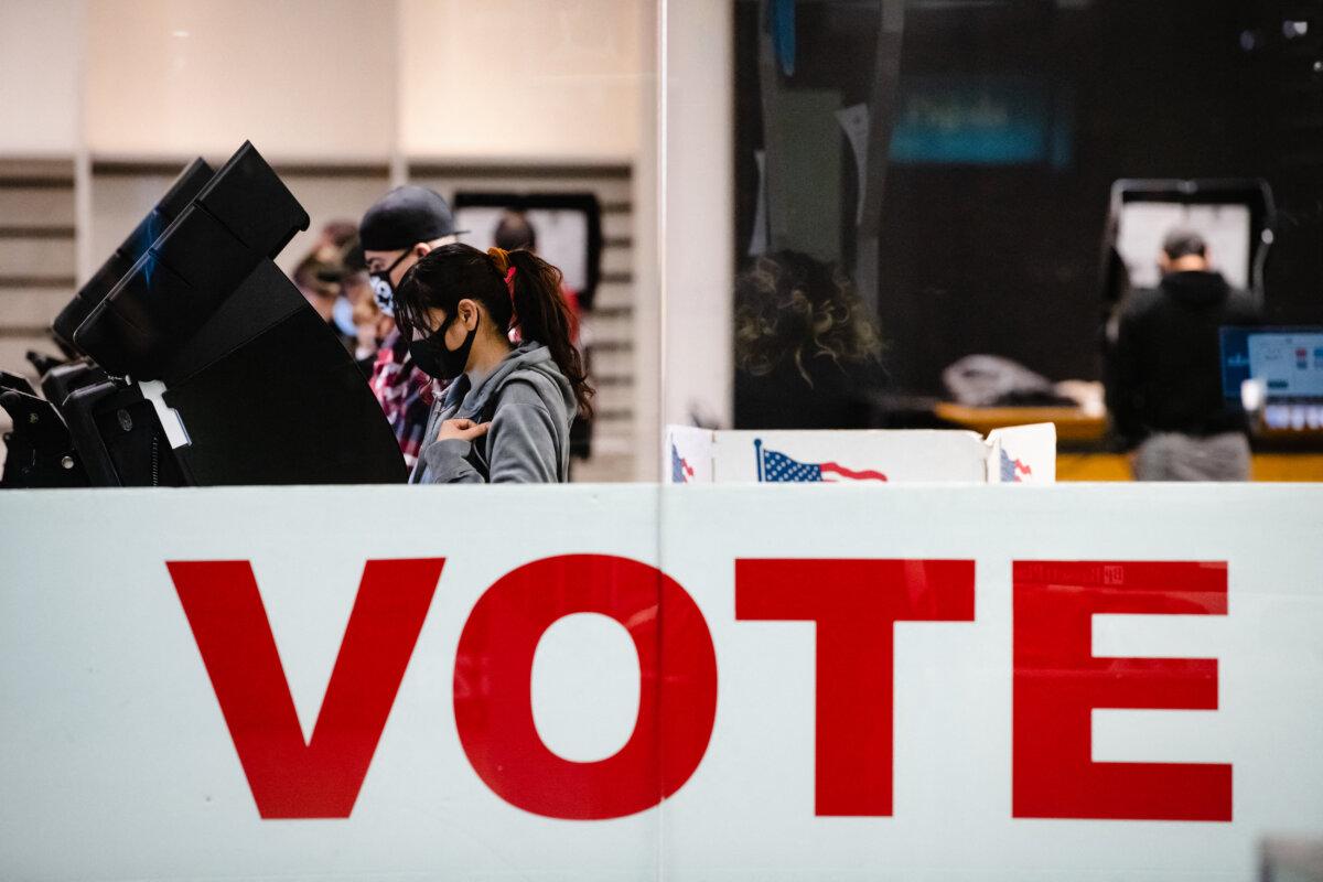 A woman casts her ballot in the 2020 general election inside the Basset Place Mall in El Paso, Texas, on Nov. 3, 2020. (Justin Hamel/AFP via Getty Images)