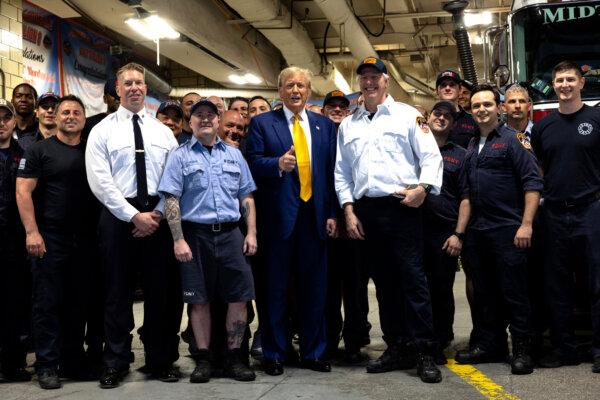 Former President Donald Trump poses for photos with members of the FDNY Engine Co. 8, Ladder Co. 2, Battalion 8 firehouse in Midtown Manhattan, New York City on May 2, 2024. (Michael M. Santiago/Getty Images)
