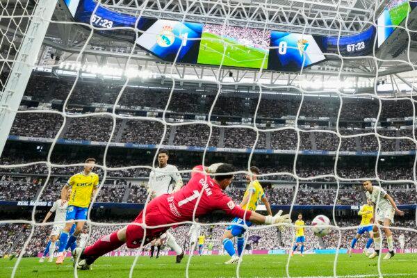 Real Madrid's Jude Bellingham(2nd L) scores his side's second goal during the the Spanish La Liga soccer match between Real Madrid and Cadiz at the Santiago Bernabeu stadium in Madrid, Spain, on May 4, 2024. (Manu Fernandez/AP Photo)