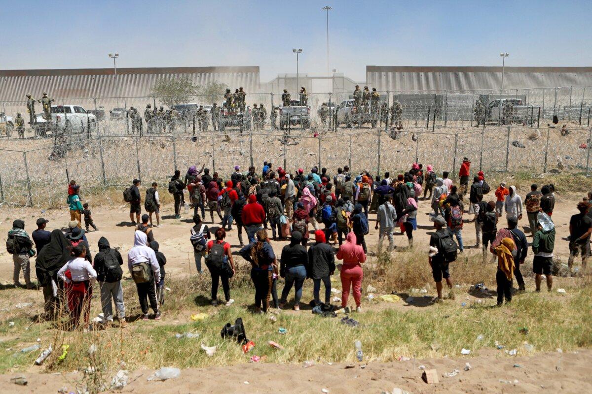 Migrants seeking asylum in the United States demonstrate on the Rio Grande river to ask for authorization to enter the country, as seen from Ciudad Juarez, state of Chihuahua, Mexico, on April 25, 2024. (Herika Martinez/AFP via Getty Images)
