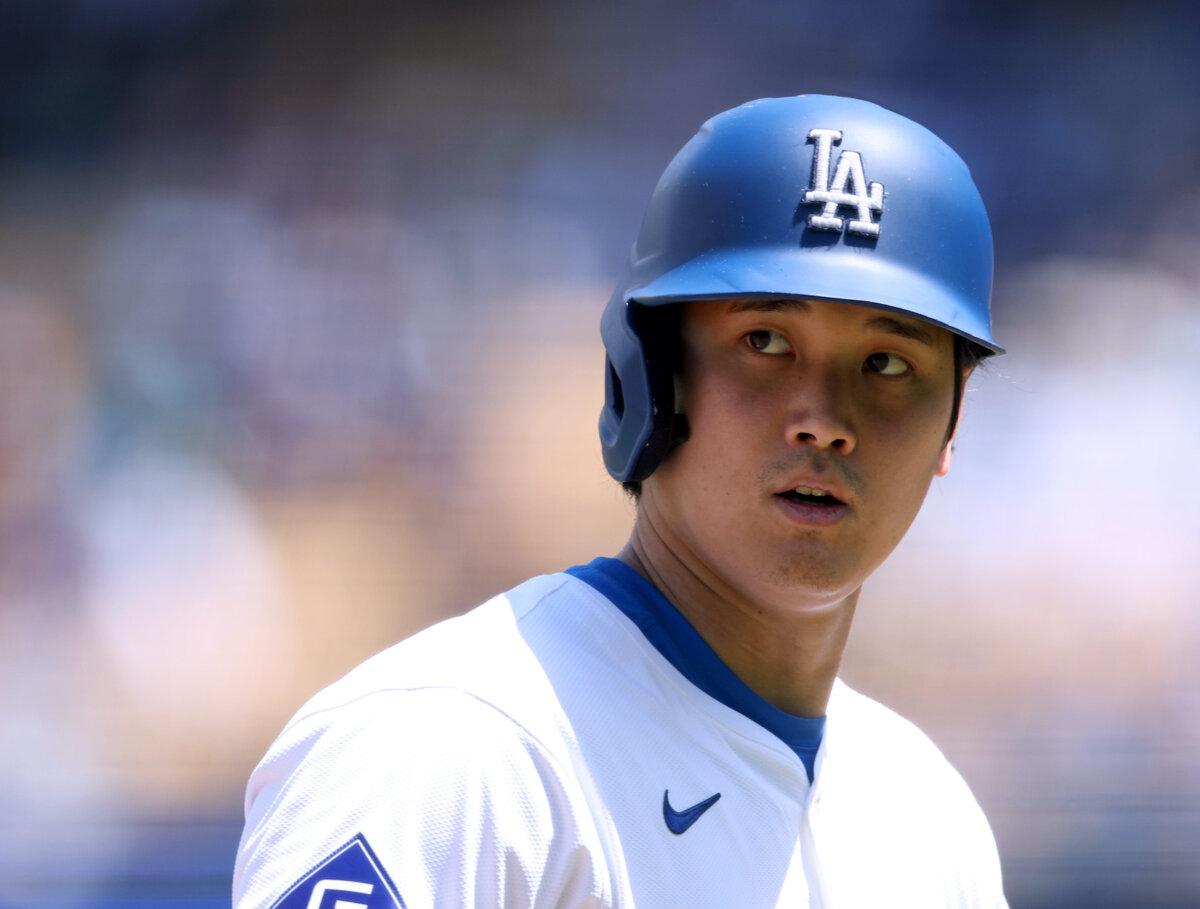 Shohei Ohtani #17 of the Los Angeles Dodgers walks back to the dugout during a 5-1 win over the Atlanta Braves at Dodger Stadium in Los Angeles, Calif., on May 5, 2024. (Harry How/Getty Images)