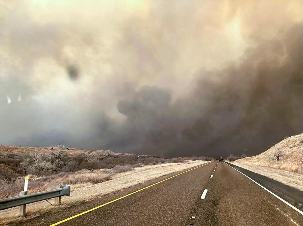 Smoke billows over a road during the Smokehouse Creek Fire in the Texas panhandle on Feb. 27, 2024. (Texas A&M Forest Service via Getty Images)