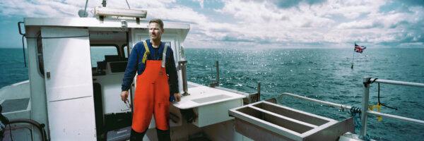 Fisherman Brian Cunningham is photographed on his boat 'The Bluefin' in the Irish Sea near Kilkeel, Northern Ireland, on Aug. 11, 2018. (Charles McQuillan/Getty Images)