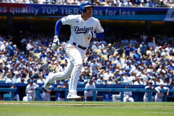 Freddie Freeman (5) of the Los Angeles Dodgers hits a double against the Miami Marlins in the sixth inning at Dodger Stadium in Los Angeles on May 8, 2024. (Ronald Martinez/Getty Images)