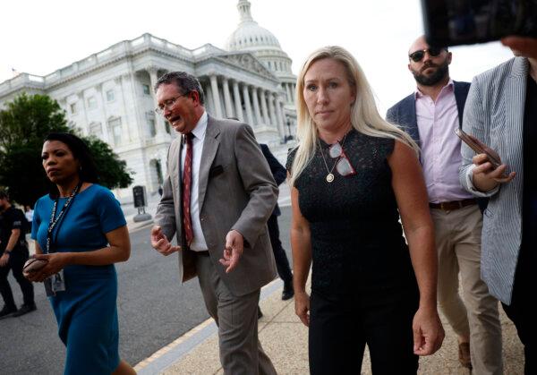 Rep. Marjorie Taylor Greene (R-Ga.) and Rep. Thomas Massie (R-Ky.) leave after talking to members of the press while exiting the U.S. Capitol after introducing a motion to vacate on the floor of the House of Representatives seeking to remove Speaker of the House Mike Johnson (R-La.) from his leadership position May 8, 2024. (Kevin Dietsch/Getty Images)