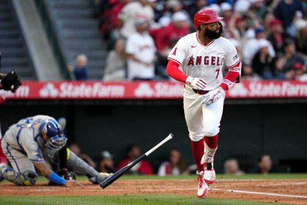 Los Angeles Angels' Jo Adell (R) heads to first after hitting a three-run home run as Kansas City Royals catcher Salvador Perez reacts during the second inning of a baseball game in Anaheim, Calif., on May 11, 2024. (Mark J. Terrill/AP Photo)