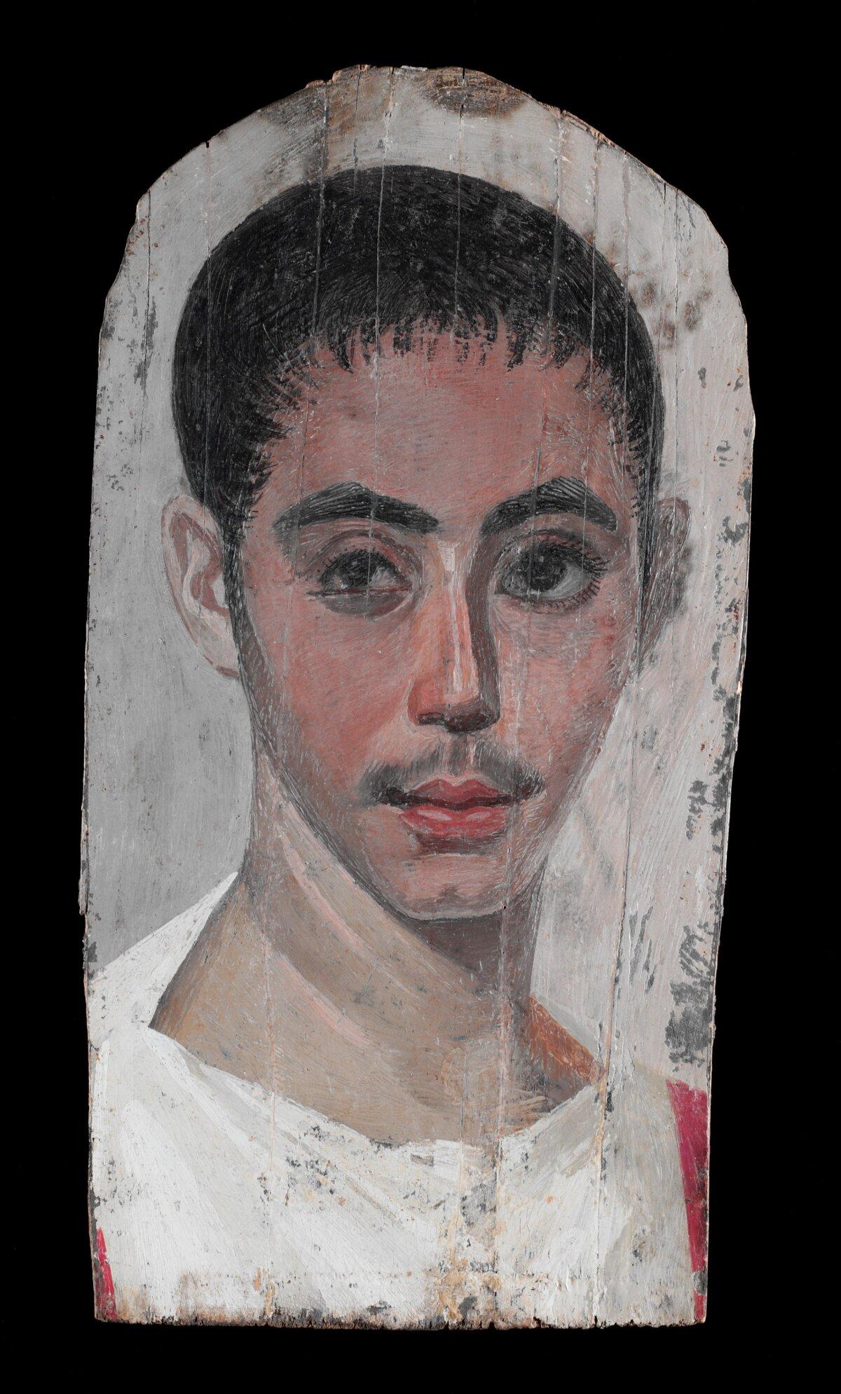 《有眼部手術痕跡的青年肖像》(Portrait of a Youth With a Surgical Cut in One Eye),公元190年至210年(埃及),由一位匿名藝術家創作。蠟畫技法於椴木板(limewood),34.9厘米 × 17.1厘米(13 3/4吋 × 6 3/4吋)。由 Rogers Fund 於1909年捐贈;現收藏於紐約市的大都會藝術博物館。(公有領域)