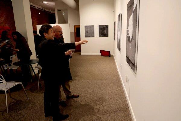Visitors view artworks created by artist Moon Insoo at Gallery Chang during his exhibition “Revealing: Moon Insoo” in Middletown, N.Y., on May 10, 2024. (The Epoch Times)