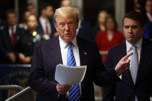 Former President Donald Trump speaks to the media during his criminal trial for allegedly covering up hush money payments at Manhattan Criminal Court, in New York City, on May 13, 2024. (SPENCER PLATT/POOL/AFP via Getty Images)