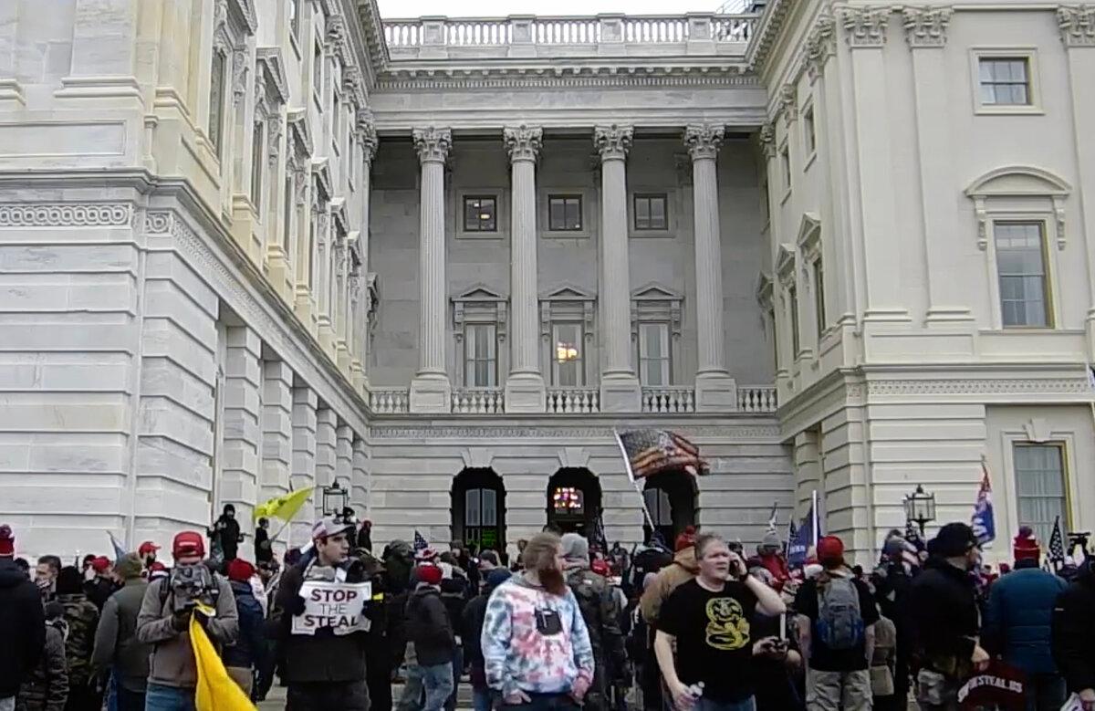 Protesters stand outside the Senate Wing Door at the U.S. Capitol on Jan. 6, 2021. (U.S. Capitol Police/Screenshot via The Epoch Times)