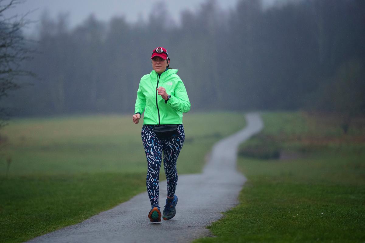 Ms. Ryvar passes through Alyn Waters Country Park in Wrexham during a half marathon. (Jon Super/AP Photo)