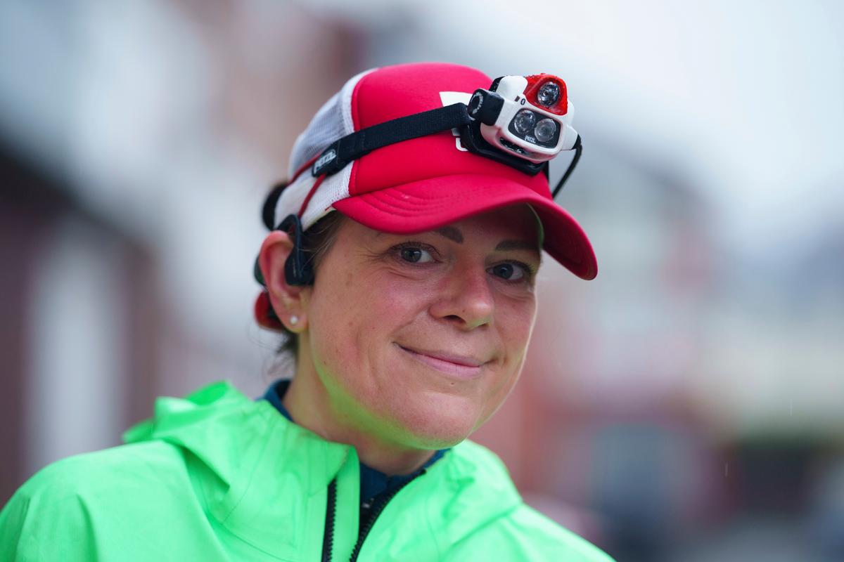 Ms. Ryvar smiles after completing a half marathon. (Jon Super/AP Photo)